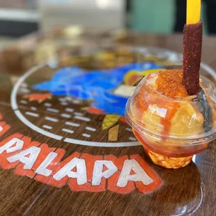 a drink in a plastic cup on a table