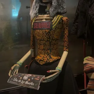 a skeleton dressed as a woman