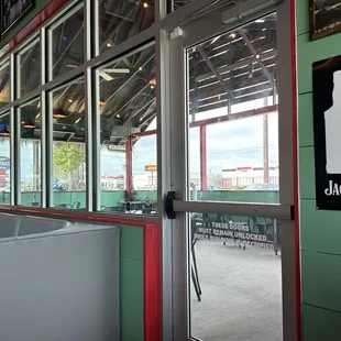 Porch area with fans and TVs