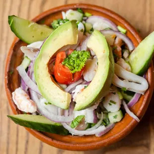 a bowl of salad with avocado