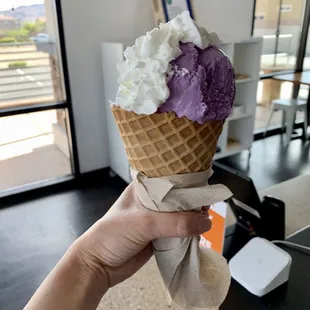Taro ice cream in a yummy waffle cone.