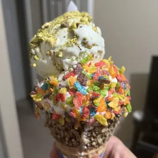 Waffle cone, pistachio ice cream, cereal ice cream.