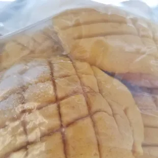 a close up of a sandwich wrapped in plastic
