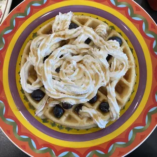 a plate of pasta with black olives