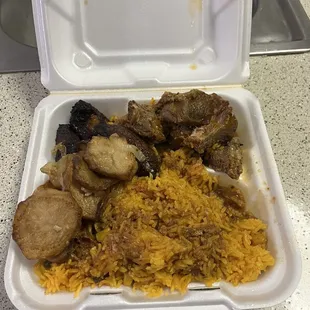 Pork with Yellow rice , fried plantains and potatoes