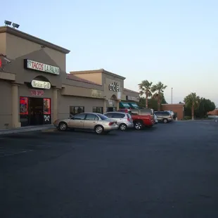 parking lot with cars parked in front