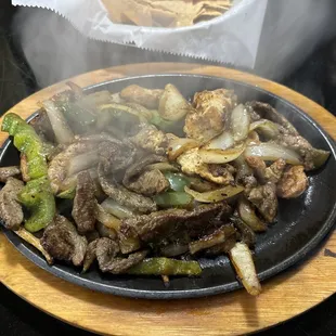a plate of steak and vegetables