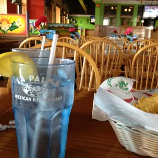 a glass of water and chips