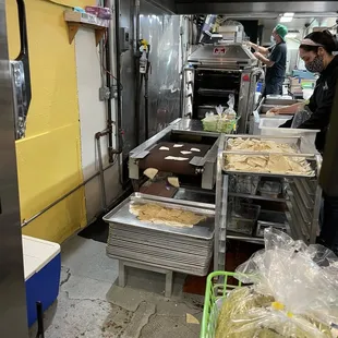 a man preparing food in a kitchen