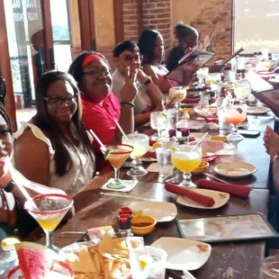 Enjoying the company and service at the restaurant.