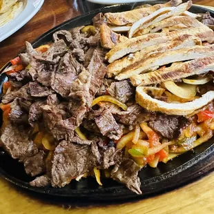 Beef and pollo asado fajita