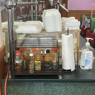 Self service, do it yourself counter, with all types of hot sauce , napkins, take out containers, hand sanitizer, etc. no need to wait.
