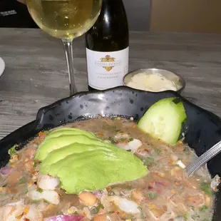 a bowl of soup and a glass of wine