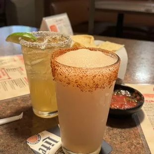 Strong Cadillac Margarita  and a virgin blended peach margarita w/ Tajin rim