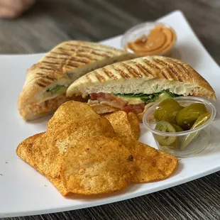 a sandwich and chips on a plate