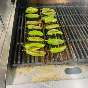 peppers cooking on a grill