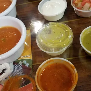 Salsas. Regular in the white container, then tomatillo green and habanero in the plastic. The salsas were just ok tasting.