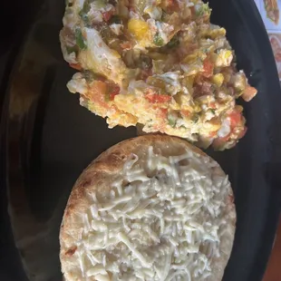 Eggs Colombian style and arepa with cheese omg