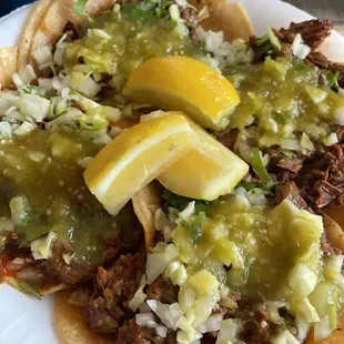 4 barbacoa tacos with green salsa