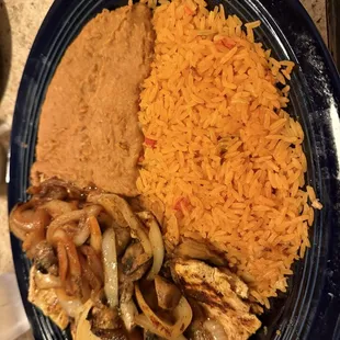 Pollo Monterey with rice and refried beans