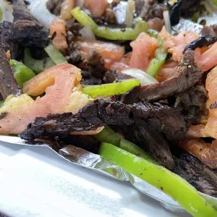 Overcooked beef/undercooked (raw) bell peppers and onions