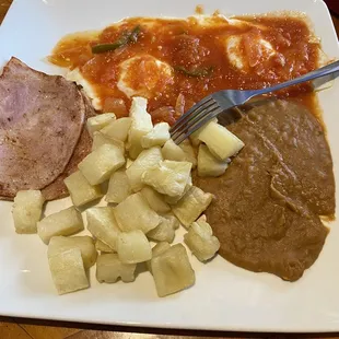 Huevos rancheros/ eggs with ranchero sauce ( you choice of sausage, bacon, ham)
