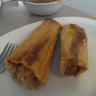 Freshly made pork tamalies with green chili salsa. Made freth this morning!