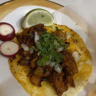 a taco with meat and vegetables