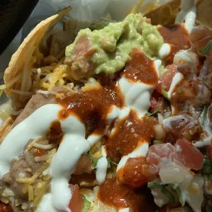 Super Nacho with steak and red salsa.