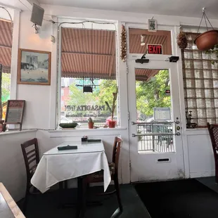 a dining room with a table and chairs