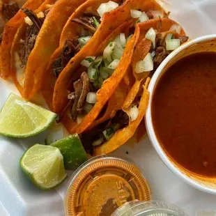 a plate of tacos and sauce