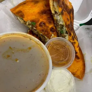 a bowl of soup and a sandwich