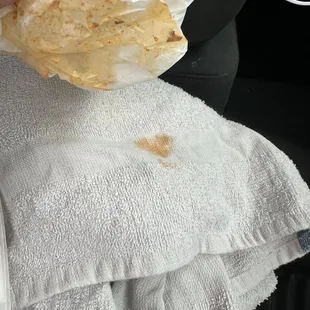 a hand holding a piece of bread