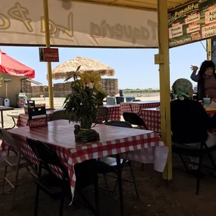 a table with a red and white checkered table cloth
