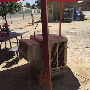 They have a swamp cooler to help keep the heat at bay even though it's outside, it helps a bit.