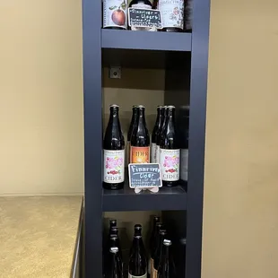 a shelf of bottles of beer