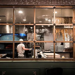 Pizza oven, fresh pasta drying in the corner