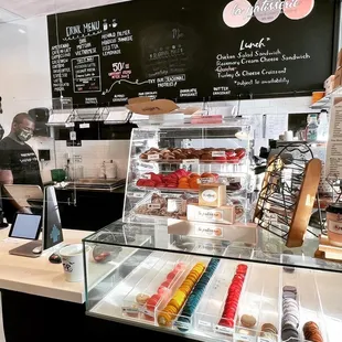 a counter with a variety of pastries