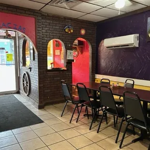 a long table and chairs in a restaurant