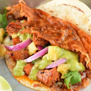 a close up of a taco sandwich