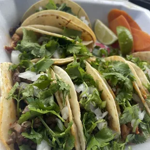 Half steak and half chicken taco order.