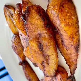 a plate of fried bananas