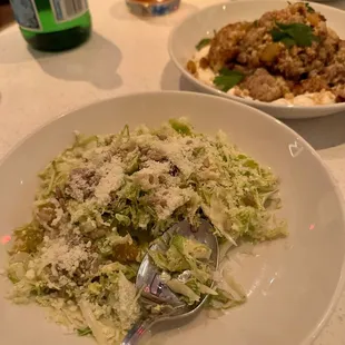 a plate of pasta and a bottle of water