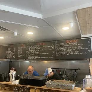 two men working behind the counter