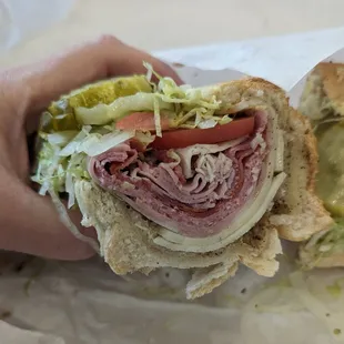 The Italiano is filled with turkey, ham, salami, capicola, mortadella, and provolone. Most important is the pickles!