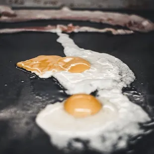two fried eggs in a pan