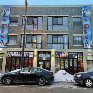 cars parked in front of the restaurant