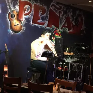 Great live musician playing an authentic Ecuadorian thingy.