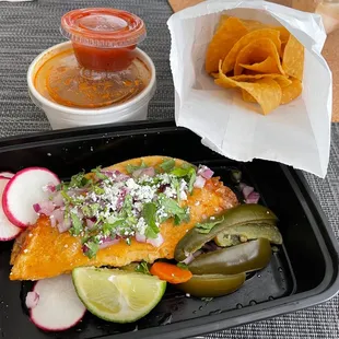 Quesabirria taco with consomme and chips