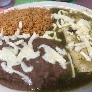 Cheese enchilada with green sauce and rice and beans